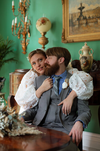 Bride & Groom portrait in romantic room.