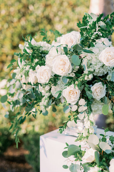 Classic white roses for wedding ceremony arch