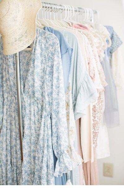 Dresses on rack from main line newborn photographers client closet