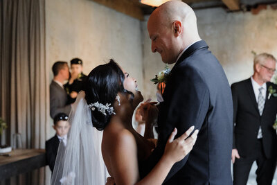 couple is dancing together after their ceremony at Charcoal Factory Loft