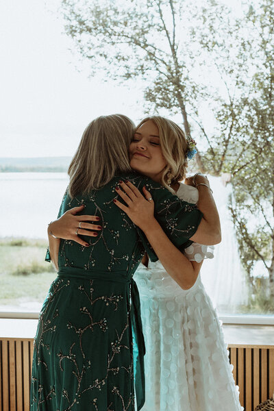 Bride and mother embrace