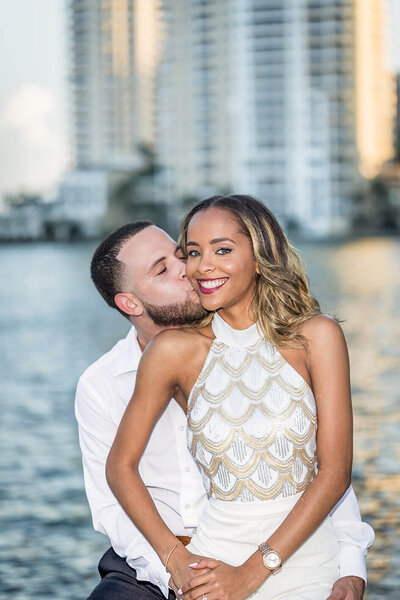Photo of Engaged Couple by Miami Wedding Photographer: This photo was captured Downtown Miami River Walk for White House Wedding Photography.