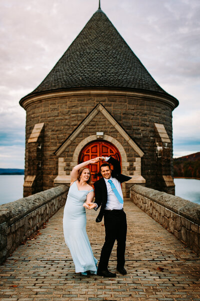 a photo of a bride and groom dancing at saville dam in connecticut