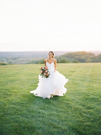 bride running across Missouri field