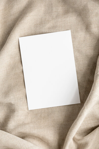 Blank White Paper on natural linen