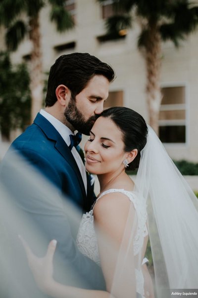 Bride and groom hug on wedding day in Sarasota, FL