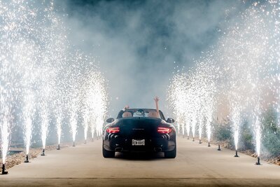 Wedding exit black car with sparklers