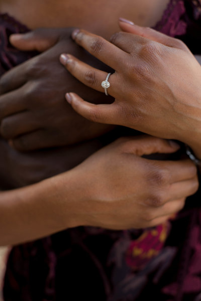 Engaged couple embraces hands for Atlanta Wedding Photographer Christina Bingham