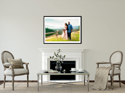 Fine Art Portrait hangs above a fireplace in a modern, neutral color schemed living room.