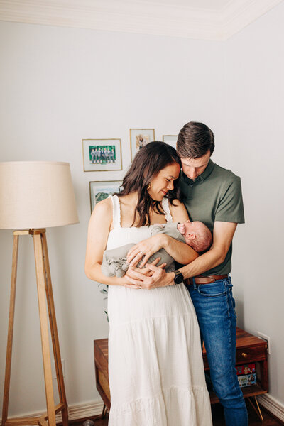 family of 3 with baby in the middle taken by a professional photographer