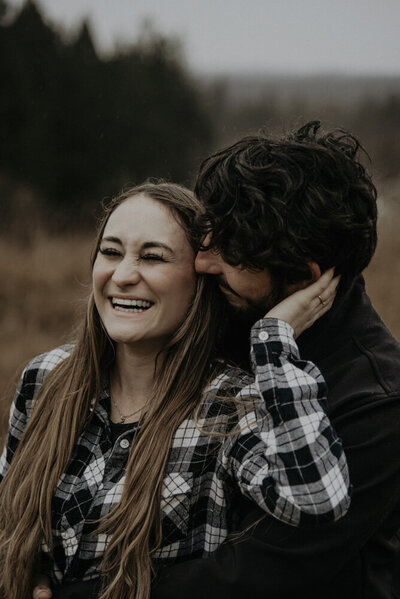 Couple laughing in the rain in Maple Ridge