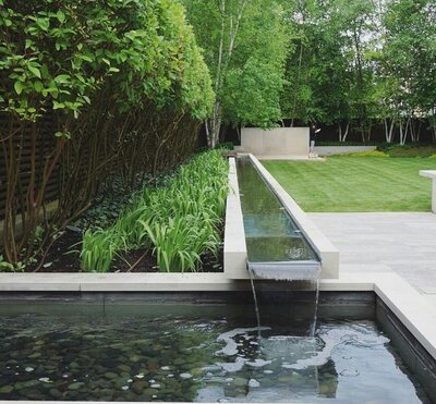 Tranquil natural zen garden with lush landscaping and serene water features