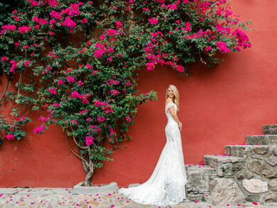 colorful bridal portrait against red wall