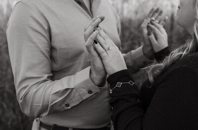 engagement of a detail shot of the womans engagement ring as she holds her hands up to her fiances captured by Knoxville photographer 