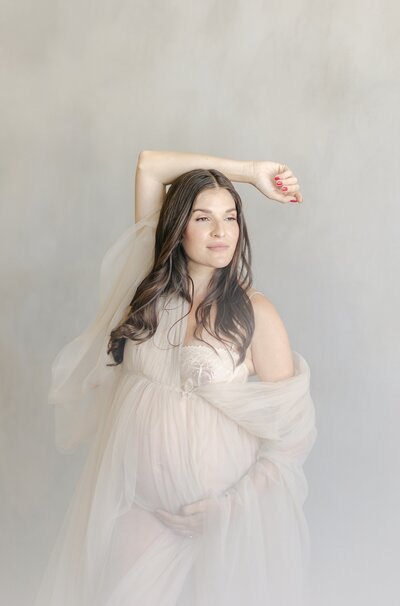Mom in tulle dress editorial style maternity photographer