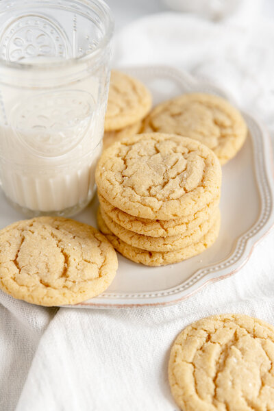 a stack of sugar cookies on a plate