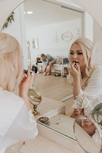bride getting ready in bridal suite