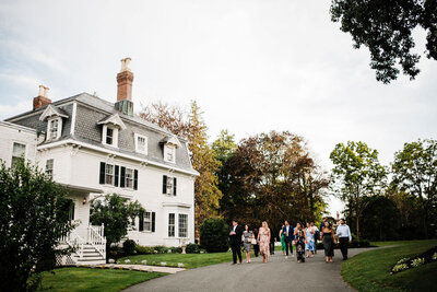 Guests walking along path at wedding venue, Blended wedding at Peirce Farm at Witch Hill