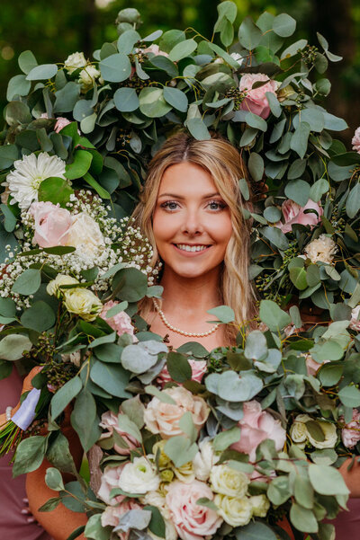 photo of bride with florals surrounding her face