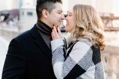 Couple about to kiss during an engagement session in downtown Chicago