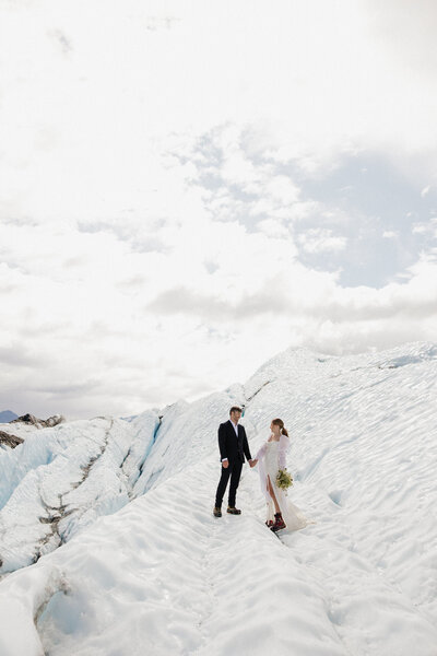 bride and groom pictures on a dock on Lake Michigan