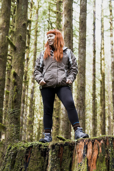 photographer standing in woods