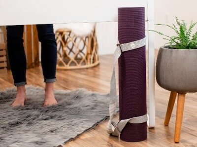 Picture of yoga mat and legs of standing person