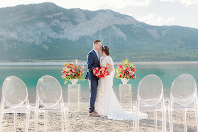 Dreamy lakeside wedding inspiration with bright florals captured by Castano Films, modern wedding videographer in Calgary, Alberta. Featured on the Bronte Bride Blog.