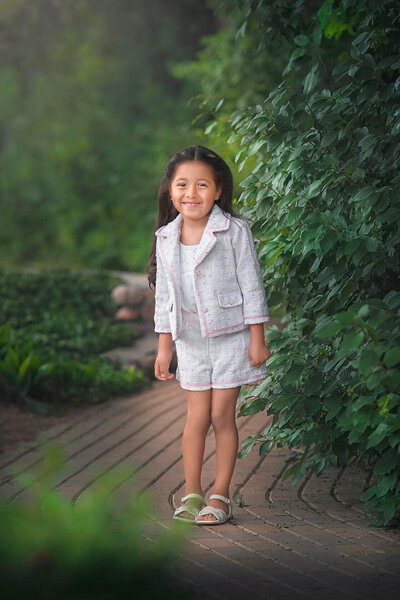 Young lady posing for her child session at the gardens