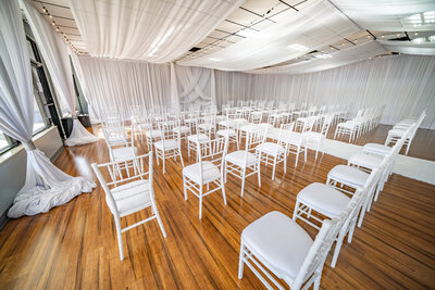 Elegant ceremony room adorned with beautiful white drapery - A captivating setting for dream ceremony and receptions