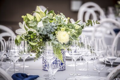 blue and white table setting at outdoor event in Colorado