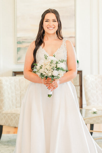 A bride holding a wedding bouquet during her bridal portrait session in Charlotte by JoLynn Photography, a Raleigh wedding photographer