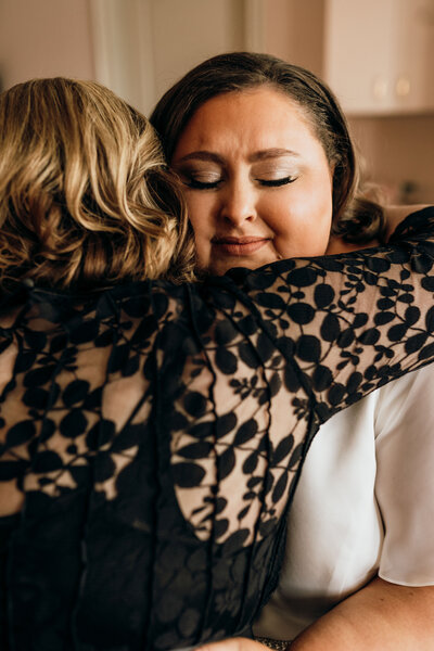 woman hugs bride