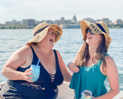 Mother and daughter laughing on a boat on Lake Mendota - Cassie Schmidt