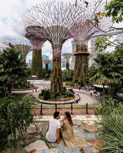 man and woman sitting at gardens by the bay singapore