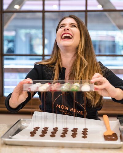 Happy student enjoys chocolate workshop by California portrait photographer
