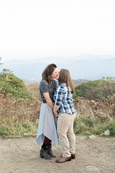 same sex couple kissing at Craggy Pinnacle couples photography Asheville, NC