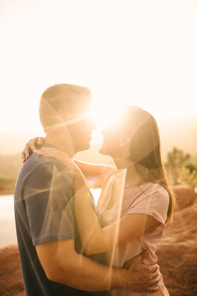 Romantic portrait of couple filled with sun flares