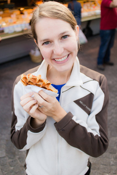 Amber eating a belgian waffle in Bruges Belgium