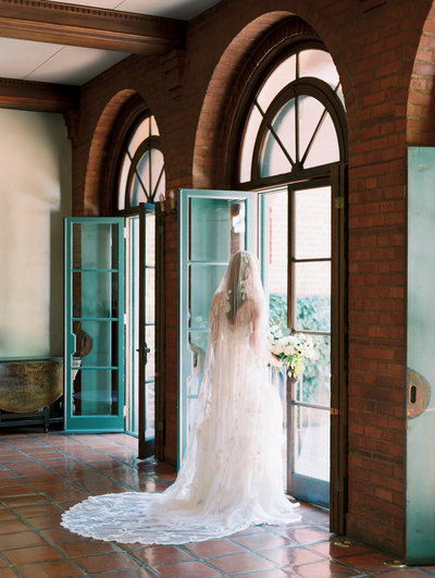 film photo of a bride with a long veil at the town club in portland, oregon