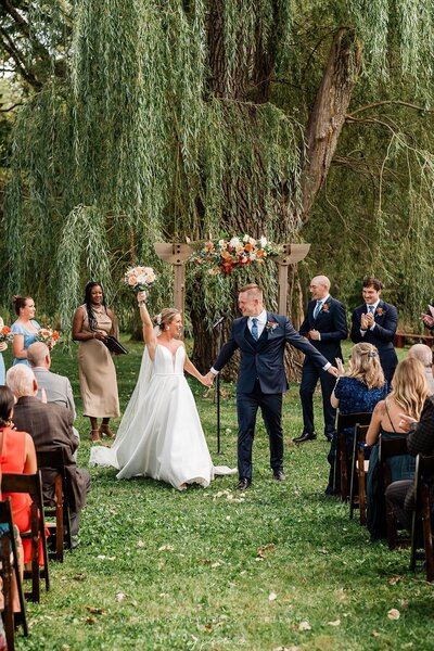 bride and groom wedding ceremony at the barnwood events in madison, winconsin.