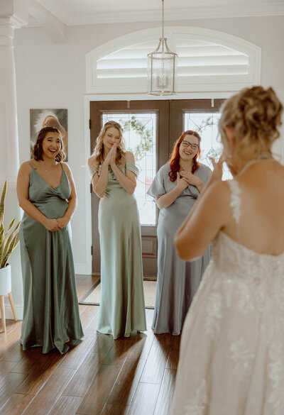 reactions from bridesmaids at first look with bride