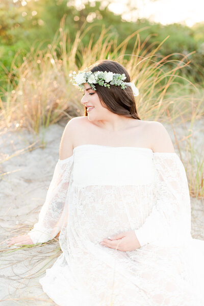 expecting mom at the beach in white maternity gown by Miami lifestyle photographers David and Meivys of MSP Photography