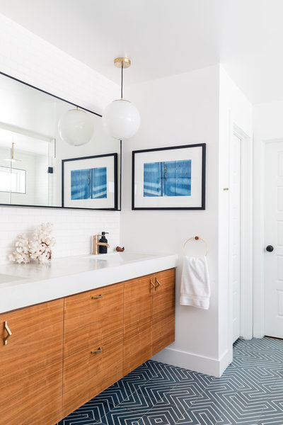 Modern blue, white, and walnut master bathroom by Denver based interior designer Fernway & Avalon