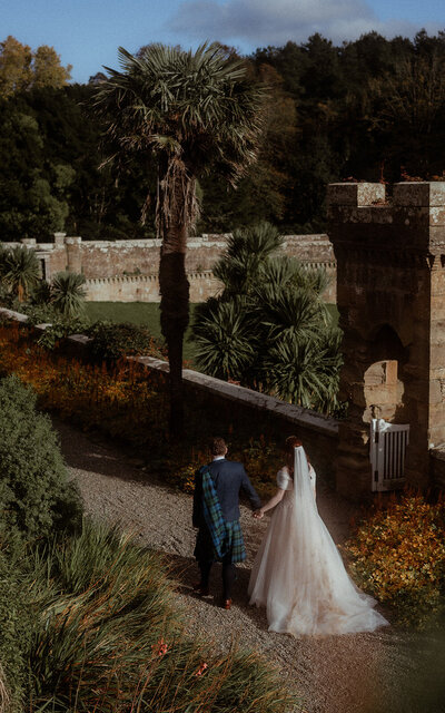 Couple walking hand-in-hand, enjoying a peaceful moment together, capturing their love and connection in a serene, natural setting