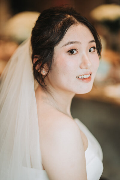 close up photo of bride and veil - professional photo edit by Uncut Gems