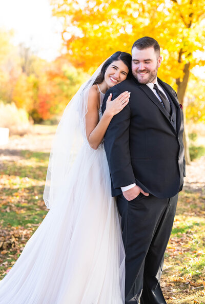 Fall Bride and Groom standing outside