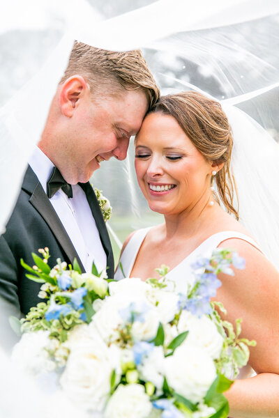bride and groom walking while holding hands