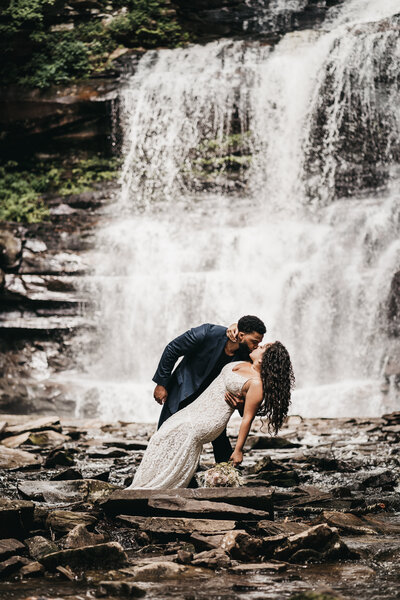 AJ kissing his bride to be during our elopement session in Ricketts Glenn State Park.