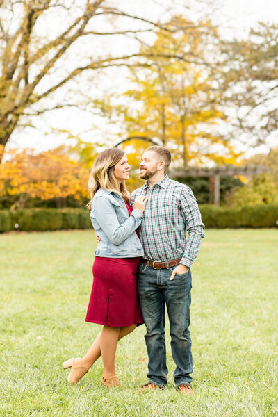 Couple embracing and looking at each other during family Fall session